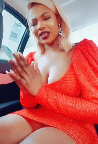 Cute Tacha Shows Cleavage in Red Dress in a Car