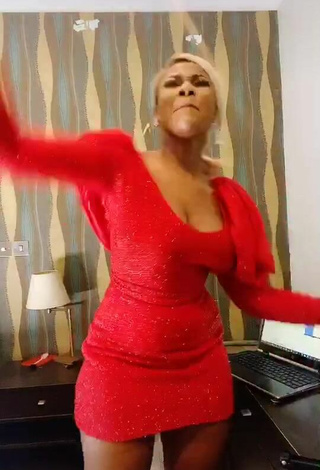 2. Hot Tacha Shows Cleavage in Red Dress