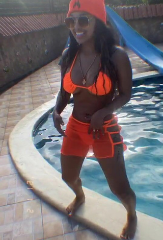 3. Cute Anyuri Lozano Shows Cleavage in Electric Orange Bikini Top at the Pool