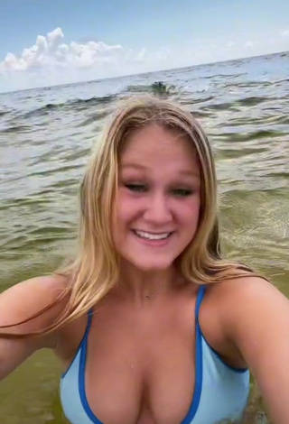Sexy Caiti Mackenzie Shows Cleavage in Blue Bikini Top in the Sea