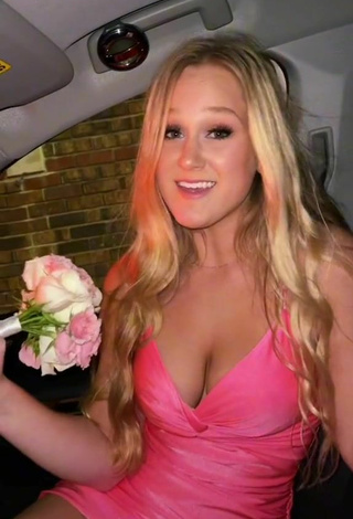 Sexy Caiti Mackenzie Shows Cleavage in Pink Dress in a Car