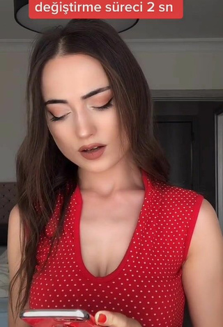 Hot Ceylan Shows Cleavage in Red Top