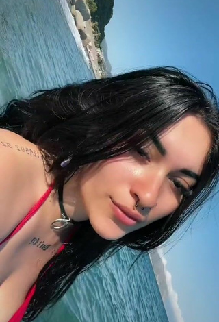 Sexy Gaia Macula Shows Cleavage in Red Bikini Top in the Sea