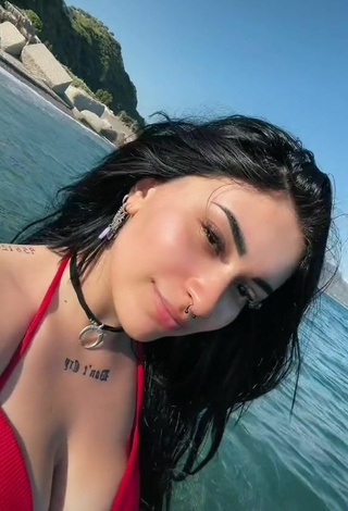6. Sexy Gaia Macula Shows Cleavage in Red Bikini Top in the Sea