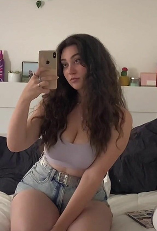 Magnificent Simone Shows Cleavage in Grey Crop Top
