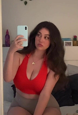 Attractive Simone Shows Cleavage in Red Crop Top