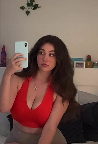 4. Attractive Simone Shows Cleavage in Red Crop Top
