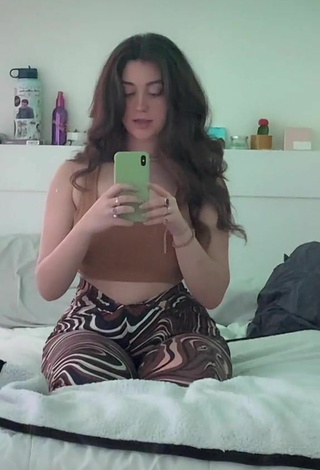 2. Hottie Simone Shows Cleavage in Brown Crop Top
