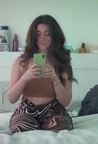 3. Hottie Simone Shows Cleavage in Brown Crop Top