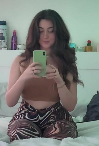 4. Hottie Simone Shows Cleavage in Brown Crop Top