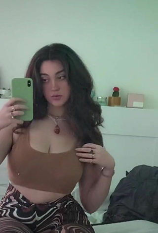6. Hottie Simone Shows Cleavage in Brown Crop Top