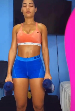 3. Sweet Ingrid Muniz Shows Cleavage in Cute Orange Sport Bra while doing Fitness Exercises
