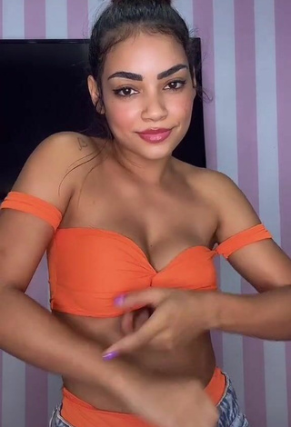 6. Breathtaking Ingrid Muniz Shows Cleavage in Orange Bikini Top