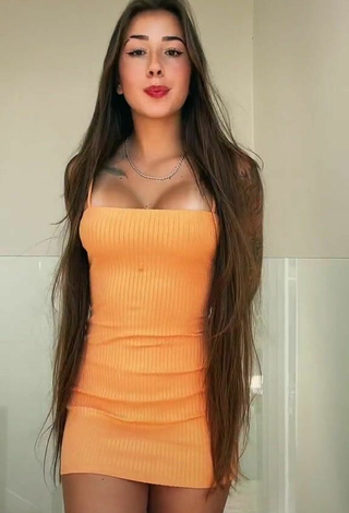 Sexy Julieta Shows Cleavage in Orange Dress