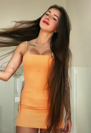 3. Sexy Julieta Shows Cleavage in Orange Dress