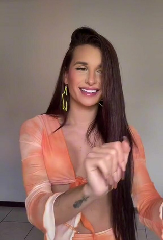 2. Sexy Marcella Pantaleão Shows Cleavage in Orange Crop Top