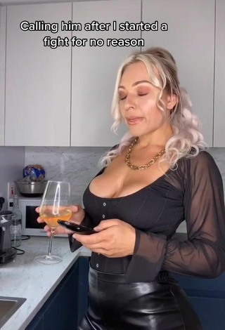 Hot Maria Shows Cleavage in Black Top