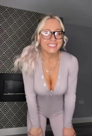 2. Beautiful Maria Shows Cleavage in Sexy Grey Overall