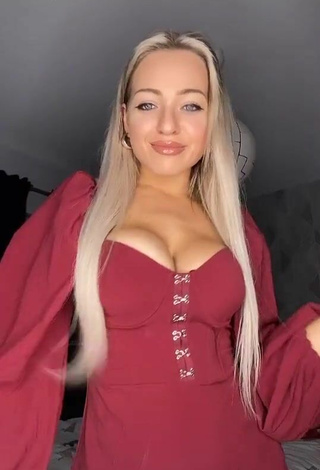 2. Erotic Maria Shows Cleavage in Red Dress