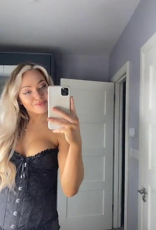 2. Hot Maria Shows Cleavage in Black Corset