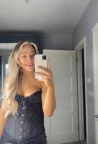 5. Hot Maria Shows Cleavage in Black Corset