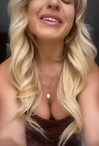 4. Sexy Maria Shows Cleavage in Brown Corset