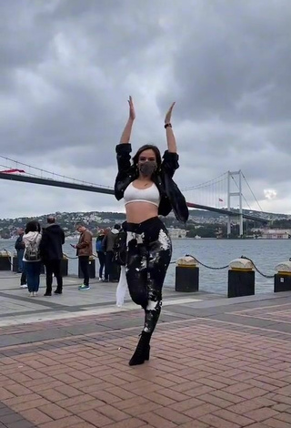 1. Sexy Melodi Özerdem in White Sport Bra in a Street
