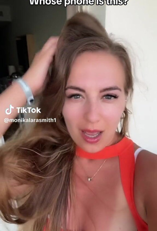 4. Sexy Monika Lara Smith Shows Cleavage in Orange Top