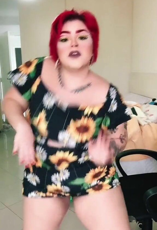 Seductive Alexia Tamira Shows Cleavage in Floral Overall