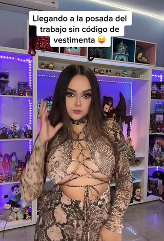 2. Cute Ama Blitz Shows Cleavage in Snake Print Dress Braless