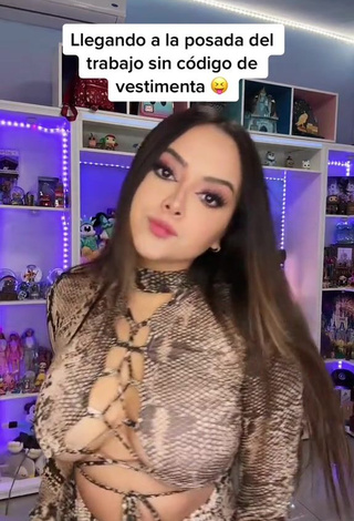 4. Cute Ama Blitz Shows Cleavage in Snake Print Dress Braless