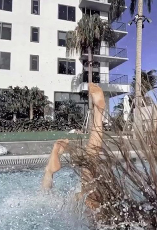 5. Amazing Amanda Cerny Shows Cleavage in Hot Brown Bikini at the Pool