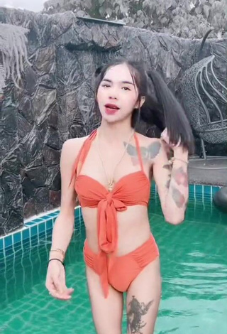 3. Atom Tattapol Shows Cleavage in Cute Orange Bikini