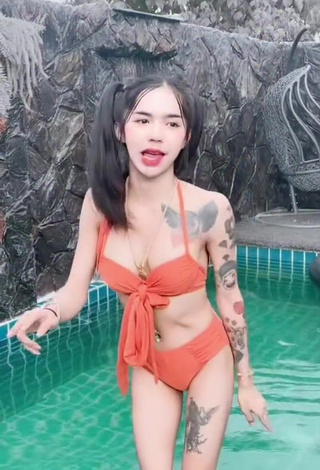 4. Atom Tattapol Shows Cleavage in Cute Orange Bikini