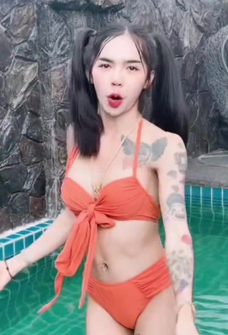 5. Atom Tattapol Shows Cleavage in Cute Orange Bikini