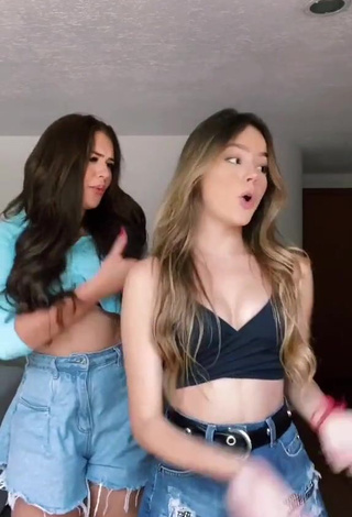 3. bela Shows Cleavage in Cute Black Crop Top