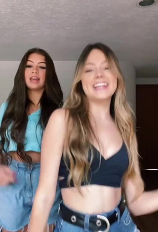 5. bela Shows Cleavage in Cute Black Crop Top