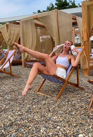 6. Diana Belitskay Looks Really Cute in White Crop Top at the Beach while Stretching