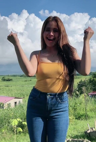 2. Hottest Christian Mae Shows Cleavage in Orange Top