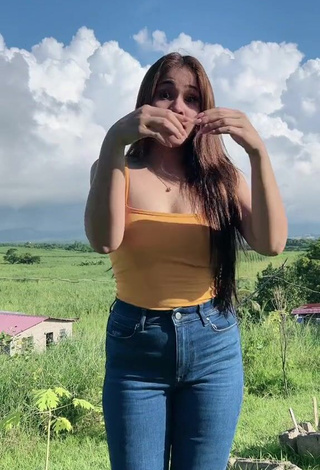 3. Hottest Christian Mae Shows Cleavage in Orange Top