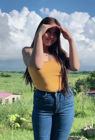 4. Hottest Christian Mae Shows Cleavage in Orange Top