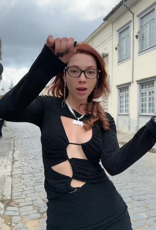 4. Sexy Cibelly Ferreira Shows Cleavage in Black Dress in a Street