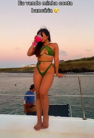 6. Lovely Ingrid Ohara Shows Cleavage in Green Bikini