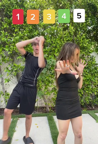 6. Sweetie McKenzi Brooke Shows Cleavage in Black Dress