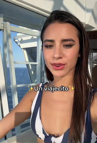 3. Dazzling Tammy Parra Shows Cleavage in Inviting Striped Bikini Top at the Swimming Pool