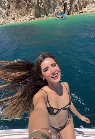 Beautiful Tammy Parra Shows Cleavage in Sexy Black Bikini on a Boat