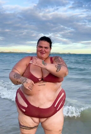 5. Wonderful Thais Carla Shows Cleavage in Red Bikini in the Sea