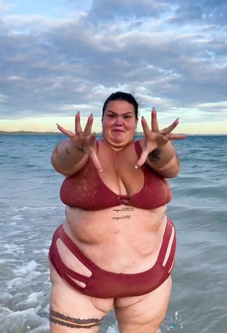 6. Wonderful Thais Carla Shows Cleavage in Red Bikini in the Sea