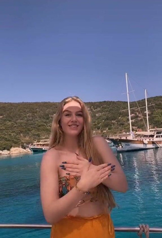 4. Sexy Tessa Bear in Snake Print Bikini Top on a Boat