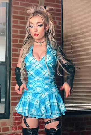 Erotic Emma Norton Shows Cleavage in Checkered Dress